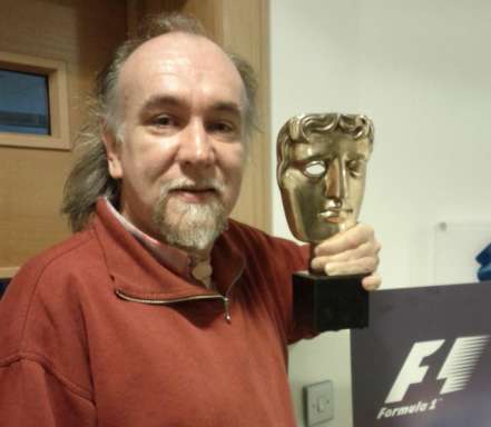 Simon with the BAFTA awarded to the F1 2010 team for the best sports game of 2011